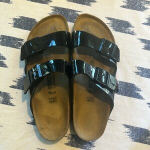 Birkenstock Arizona sandals size 41 N.  Black patent. Includes original box.